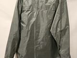 the back view of a green jacket hanging on a hanger