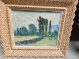 tableau représentant un paysage avec des arbres et une rivière, dans un cadre doré