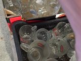 many empty plastic cups in the bins on the counter