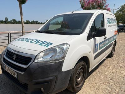 a white van that is parked on the side of the road