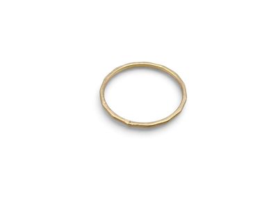 a gold ring on a white background