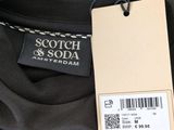 a close up of a black shirt with a tag on it