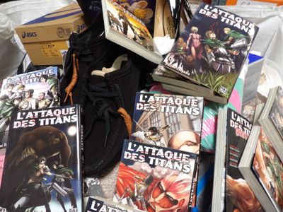 a lot of books and a pair of shoes on a table