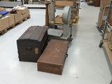 several suitcases and boxes are sitting on the floor in a warehouse