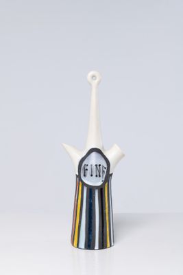 a white vase with a black and white design on it