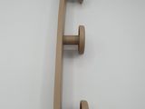 a skateboard with a blue handle hanging on a wall