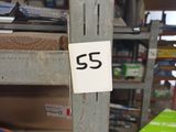 a picture of a sign on a metal pole in a store