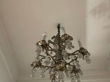 a chandelier hanging from the ceiling in a room