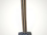 an image of a black and gold pedestal with a square base
