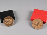 two coins sitting next to each other on a table