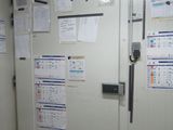 a white door with a bunch of papers on it