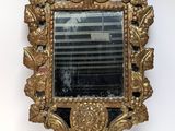 a mirror that is hanging on the wall in the room