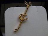 an image of a gold plated necklace with a letter c on it