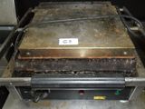 an image of a grill with a lot of food on it