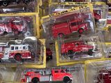 many different types of toy fire trucks in the box