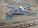 a wooden pallet that has some blue tools on top of it