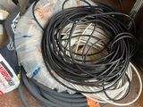 a pile of wires and a hose on the floor
