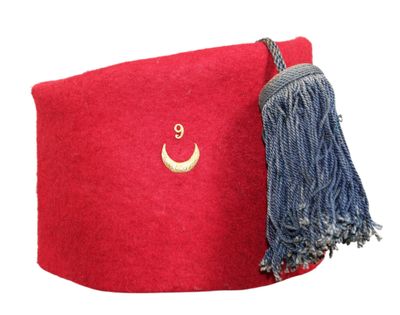 a red bag with a tassel and a crescent on it