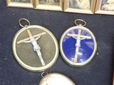 three framed pictures of a crucifix and a picture of a man on a cross