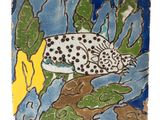 an image of a ceramic tile with a fish on it