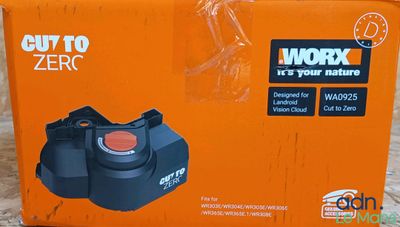 an orange box with a black handle and a red button on it