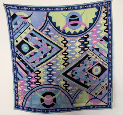 an image of a colorful scarf hanging on a wall