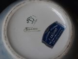 a blue and white plate with a picture of a horse on it
