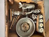 a wooden box filled with assorted tools on top of a table