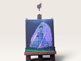 une maquette miniature d'un vaisseau spatial posée sur un petit chevalet