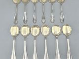 a set of eight silver spoons with handles and handles