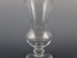 a glass vase that is sitting on a table