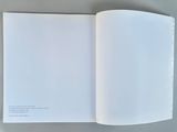 a book open to a page with a picture of a cat on it