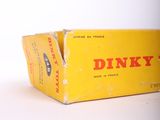 a box of dinky cigarettes sitting on a white surface