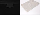 black and white photograph of a bag and a bag of toilet paper