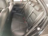 the back seats of a car are empty and the passenger seat is empty