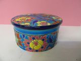 a blue and yellow box with a flower design on it
