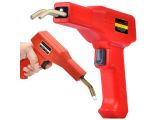 a close up of a hand holding a hot glue gun