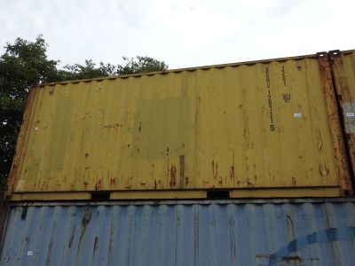 a yellow and blue container sitting on top of a blue and yellow container