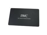 black business card with a white iwc logo on it