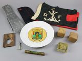 a white plate with a knife and other items on a table