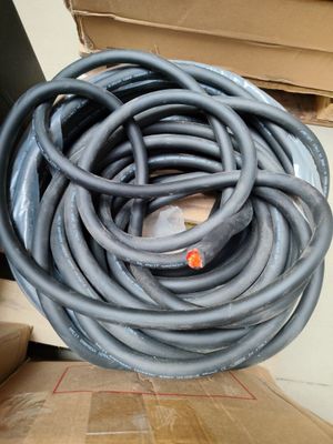 a large pile of hoses sitting on top of a cardboard box