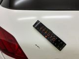 a sticker on the back of a car that has a sticker on it