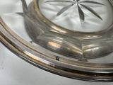 a silver plate with a circular design on it
