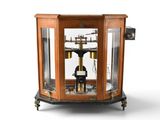 a clock that is sitting inside of a glass case