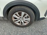 a close up of a tire on a white car