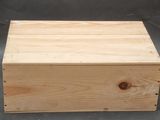 a close up of a wooden box sitting on a table