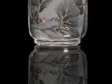 a glass snuff bottle with a painting on it