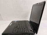 a black laptop computer sitting on a white surface