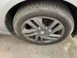 a close up of a car ' s tire on the ground