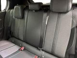 the back seats of a car with two rows of seats in it
